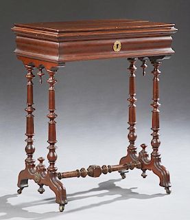 English Carved Mahogany Work Table, 19th c., the stepped sloping hinged top opening to an inset mirror and compartmentalized 
