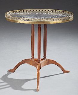 French Carved Walnut Oval Marble Top Cocktail Table, early 20th c., the oval highly figured grey marble within a pierced bras