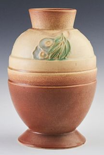 Roseville Pottery Futura Vase, 428-8, c. 1924, of egg shape with raised floral and leaf decoration, H.- 8 in., Dia.- 5 1/2 in