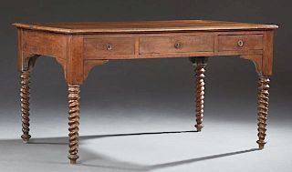 French Provincial Louis Philippe Carved Walnut Desk, 19th c., the rectangular top over a center frieze drawer flanked by deep