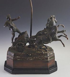 Patinated Spelter Figural Lamp, 20th c., with a charioteer and his horses, on a stepped wood and ebonized octagonal base, wit