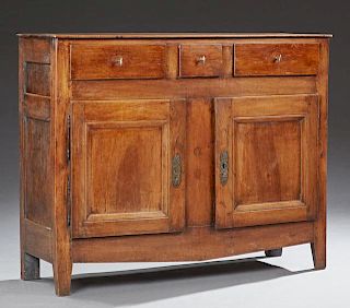 French Louis Philippe Style Carved Walnut Sideboard, 19th c., the rectangular top over three frieze drawers above double cupb
