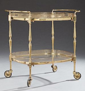 French Two Tier Brass and Glass Serving Cart, 20th c., with reticulated brass galleries around each glass shelf, the top with