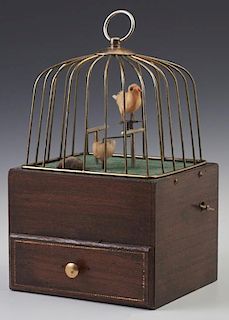 Mahogany and Brass Singing Bird Automaton, early 20th c., the base with drawer, the bird rotating to the music, working, H.- 