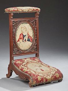 French Carved Walnut Prie Dieu, 19th c., with original needlework upholstery with iron tack decoration, the cushioned needlew
