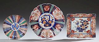 Group of Three Pieces of Imari Porcelain, 19th c., consisting of a large scalloped charger; a small ribbed charger by Korauch