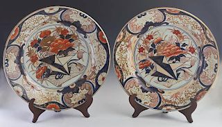 Pair of Large Imari Porcelain Chargers, late 19th c., with floral decoration in the typical Imari gilt, orange and blue palet