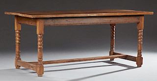 French Provincial Carved Oak Farmhouse Table, 19th c., the rectangular top over a wide skirt on turned tapers legs joined by 