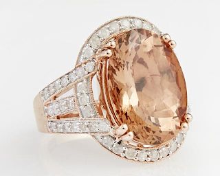 Lady's 14K Rose Gold Dinner Ring, with a 10.14 carats cabochon oval Ethiopian opal atop a border of round diamonds, the shoul