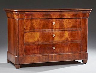 French Louis Philippe Carved Walnut Commode, c. 1860, the rounded corner two board two over a cavetto frieze drawer and three