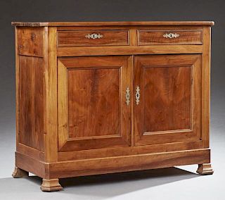 French Louis Philippe Carved Walnut Sideboard, 19th c., the canted corner top over two frieze drawers above double cupboard d