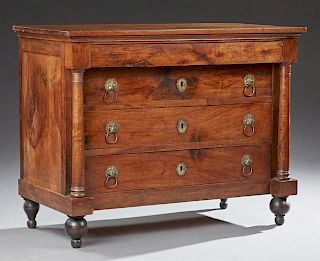 French Empire Carved Walnut Commode, early 19th c., the rectangular top over a "secret" frieze drawer above three setback dee