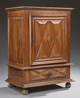 French Provincial Carved Cherry Confiturier, 19th c., the stepped top over a large door with applied relief geometric carving
