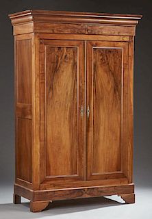 French Louis Philippe Carved Walnut Armoire, 19th c., the stepped ogee crown over double doors, on a plinth base on bracket f