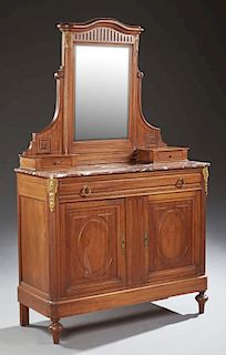 Louis XVI Style Mahogany Marble Top Dresser, late 19th c., the arched crest over a wide beveled mirror, flanked by sloping ge