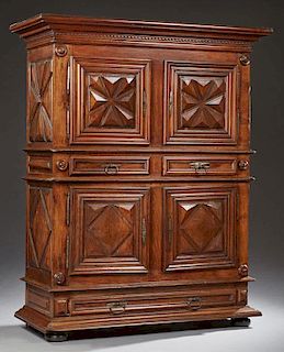 Unusual French Louis XIII Style Carved Oak Homme Debout Armoire, 19th c., the stepped ogee crown over double cupboard doors w