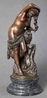 Continental School, "The Bather," 20th c., patinated bronze on a figured stepped black circular figured marble base, H.- 19 i