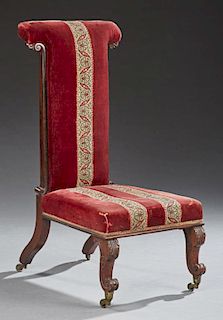 Louis XV Style Carved Mahogany Prie Dieu, late 19th c., the rounded armrest over an upholstered rectangular back, to a trapez