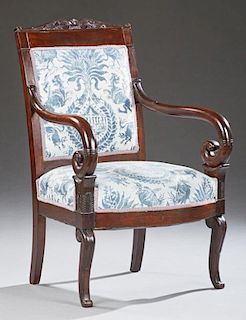 Regency Style Carved Mahogany Armchair, late 19th c., the arched crest over an upholstered back to scrolled arms over a bird 