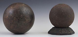 Two War of 1812 Iron Cannon Balls, 19th c., dug from the levee in Chalmette, one- Dia.- 4 3/4 in., Wt.- 15 lbs; one Dia.- 6 1