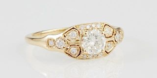 Lady's 14K Yellow Gold Dinner Ring, with a .5 carat round diamond centering a hexagonal mount with small round diamonds, diam