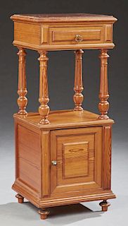 French Henri II Carved Pitch Pine Marble Top Nightstand, c. 1880, the inset rouge marble over a frieze drawer, on turned tape