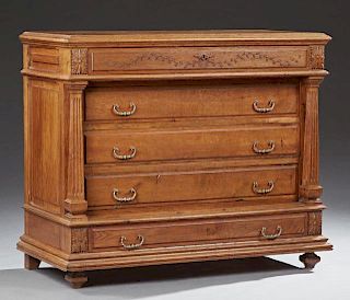 French Henri II Style Carved Oak Commode, c. 1850, the stepped rounded edge top over a frieze drawer and two setback drawers,