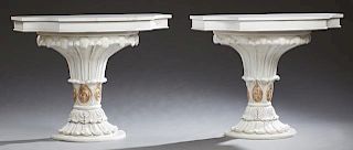 Pair of Polychromed Carved Wood Console Tables, late 20th c., the demilune tops with wide skirts on a scalloped plinth with a