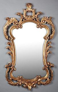 French Louis XV Style Carved Poplar Gilt Overmant Mirror, early 20th c., the pierced leaf and scroll crest over a shaped scro