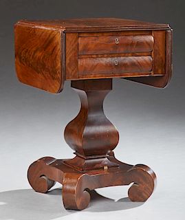 American Classical Revival Carved Mahogany Drop Leaf Work Table, late 19th c., the rectangular top over two cavetto drawers o