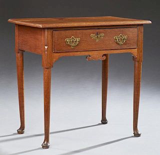 Diminutive English Queen Anne Style Carved Oak and Walnut Writing Table, early 20th c., the stepped rectangular top over a si