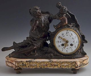 French Patinated Spelter and Marble Figural Mantle Clock, late 19th c., with a classically draped seated female next to an en