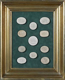 Group of Eleven Plaster Intaglios, 19th c., Grand Tour Souvenirs, presented in a gilt green velvet shadowbox frame, H.- 11 7/
