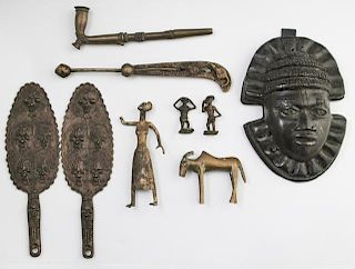 Group of Nine African Benin Bronzes, 20th c., consisting of a pipe; a mask; a goat; a woman; two small male figures; and a we
