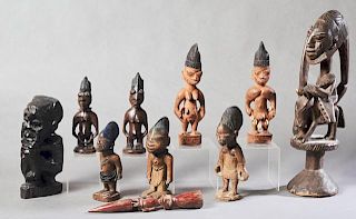 Group of Ten African Carved Wood Figures, 20th c., consisting of three pair of tribal figures; a single standing male; a seat