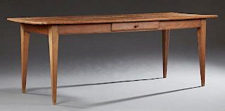Carved Pine Farmhouse Table, 19th c., the rectangular plank top over a wide skirt, with a side drawer on square tapered legs,
