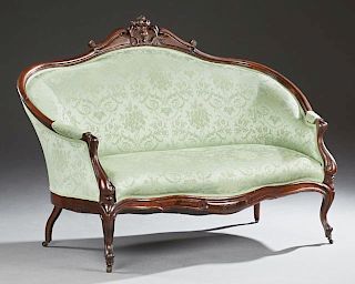 American Carved Rosewood Canape, late 19th c., the arched back with a pierced egg and scroll crest, over an upholstered back 