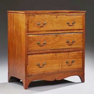 American Carved Mahogany and Walnut Inlaid Chest, 20th c., the rectangular banded edge top over three long drawers, on bracke