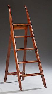 Regency Style Mahogany and Brass Folding Library Ladder, early 20th c., the brass edged steps supported by mahogany ends with