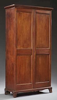 American Federal Style Carved Mahogany Armoire, 19th c., the stepped ogee crown over two double paneled doors, on a plinth ba