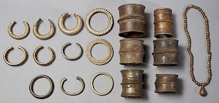 Group of Seventeen Pieces of African Bronze Jewelry, 20th c., consisting of six wide cuff bracelets, ten bangle bracelets, an