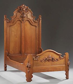 American Carved Walnut Highback Single Bed, 19th c., probably Mitchell and Rammelsberg, Cincinnati, the arched high back with