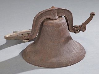 Cast Iron Plantation Bell, 20th c., with mounting yoke, H.- 13 in., H.- 13 in., W.- 18 1/4 in., D.- 14 in.