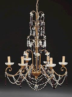 French Gilt Iron Six Light Chandelier, 20th c., hung with clear prisms, prism chains and black tear drop prisms, the six scro