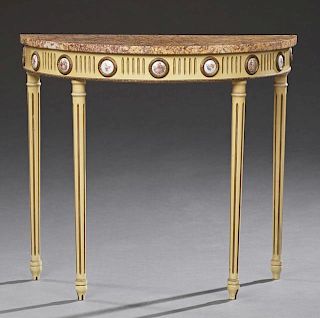 Louis XVI Style Marble Top Console Table, 20th c., the highly figured demi-lune tan and violet marble over a reeded skirt mou
