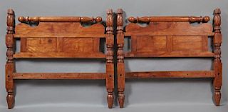 American Empire Carved Cherry Sleigh Bed, 19th c., the turned roling pin tops over scrolled paneled headboards, flanked by pi