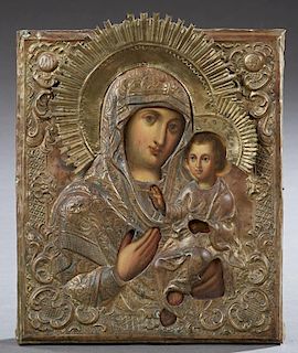 Russian Icon of the Virgin of Kazan, 19th c., with a brass riza, H.- 13 in., W.- 10 3/8 in. Provenance: The Estate of Dr. Cha