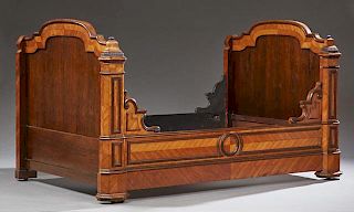 French Louis Philippe Carved Mahogany Lit du Coin, 19th c., the arched sleigh head and footboards joined by rails with shaped