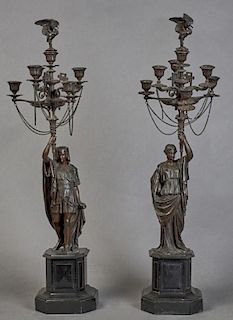 Pair of French Patinated Bronze and Black Marble Figural Seven Light Candelabra, c. 1870, with a central raised candle cup wi
