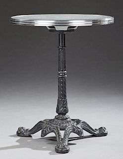 French Marble Top Bistro Table, 20th c., the circular silver bound grey and teal figured marble on a tapered reeded cast iron